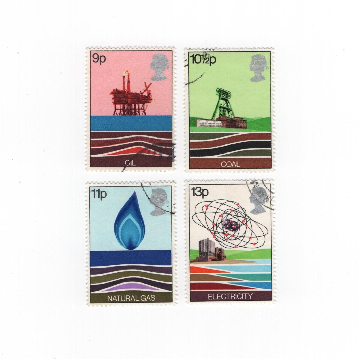 Four stamps depicting energy sources on a white background