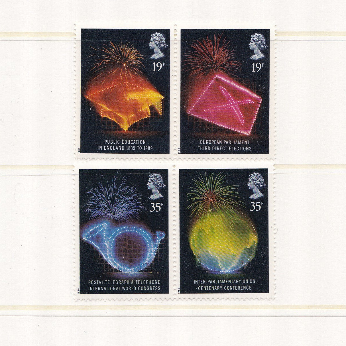 Four postage stamps with colorful designs and text on a white background