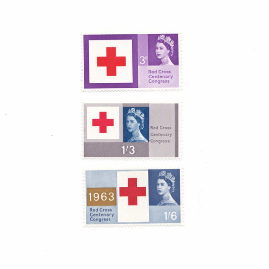 Three vintage stamps featuring a red cross design on a white background