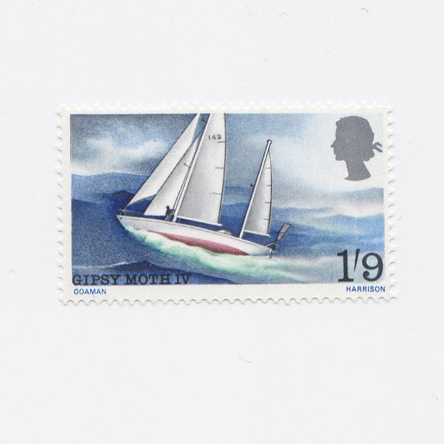 Postage stamp showing yacht sailing on waves.
