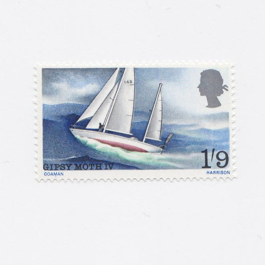 Postage stamp showing yacht sailing on waves.