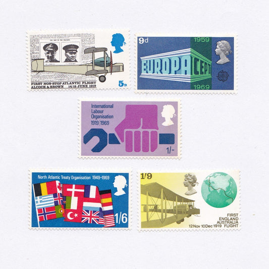 Collection of vintage postage stamps on a light gray background