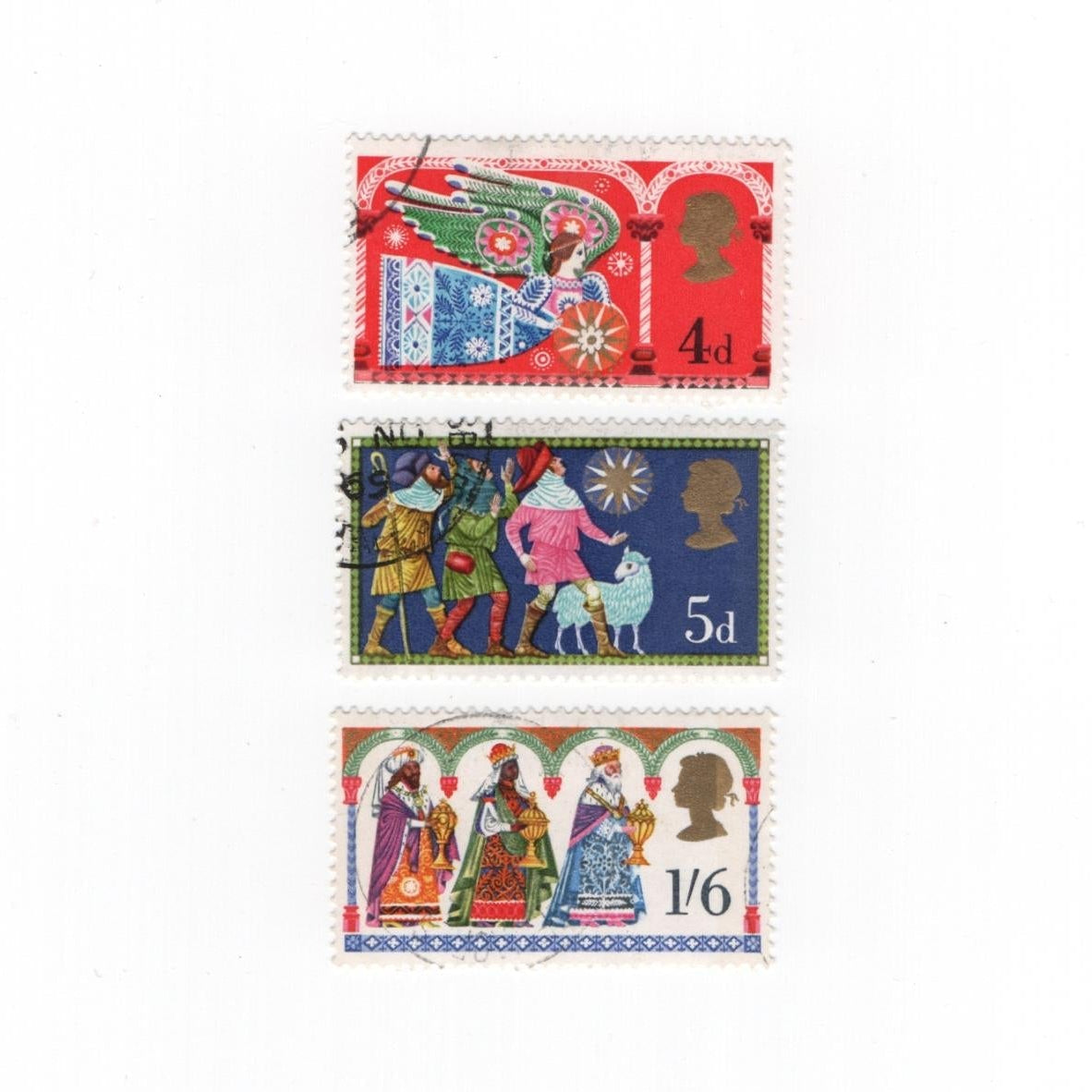 Three vintage postage stamps with colorful designs on a white background