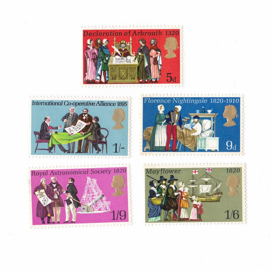 Set of five vintage stamps featuring historical scenes and figures on a white background.