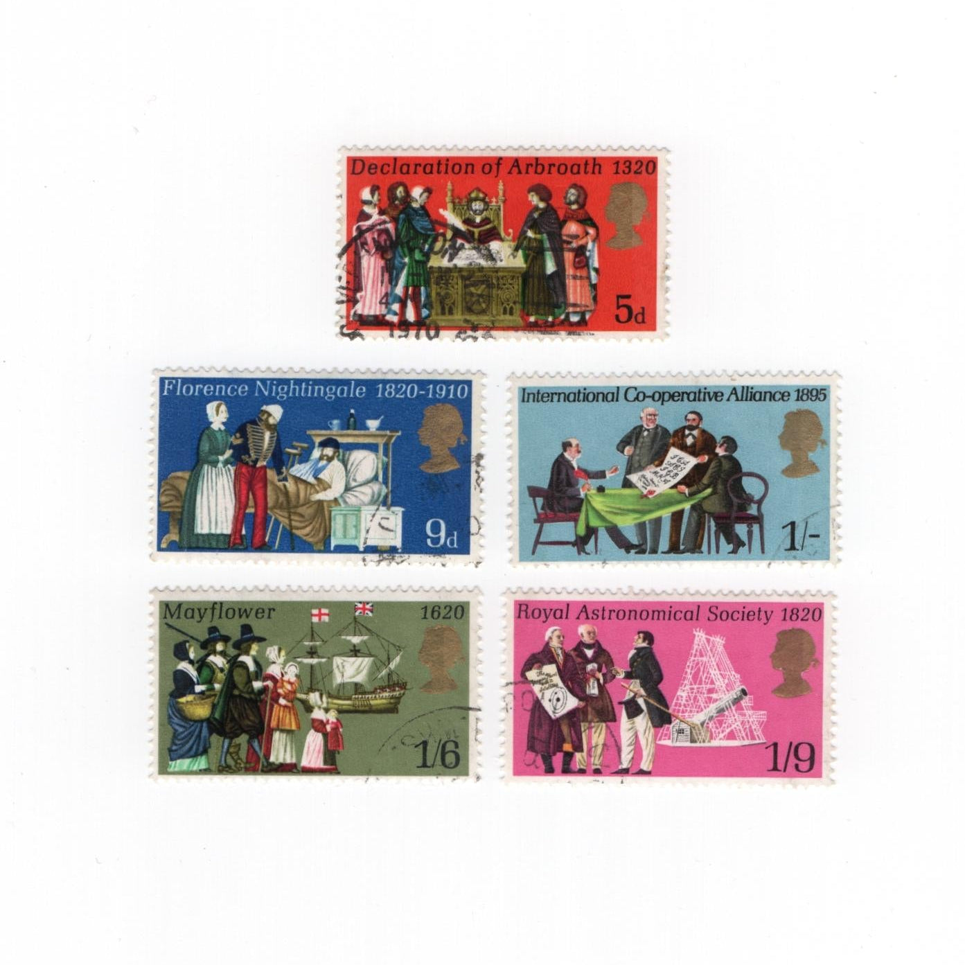 Set of five vintage stamps with historical scenes on a white background