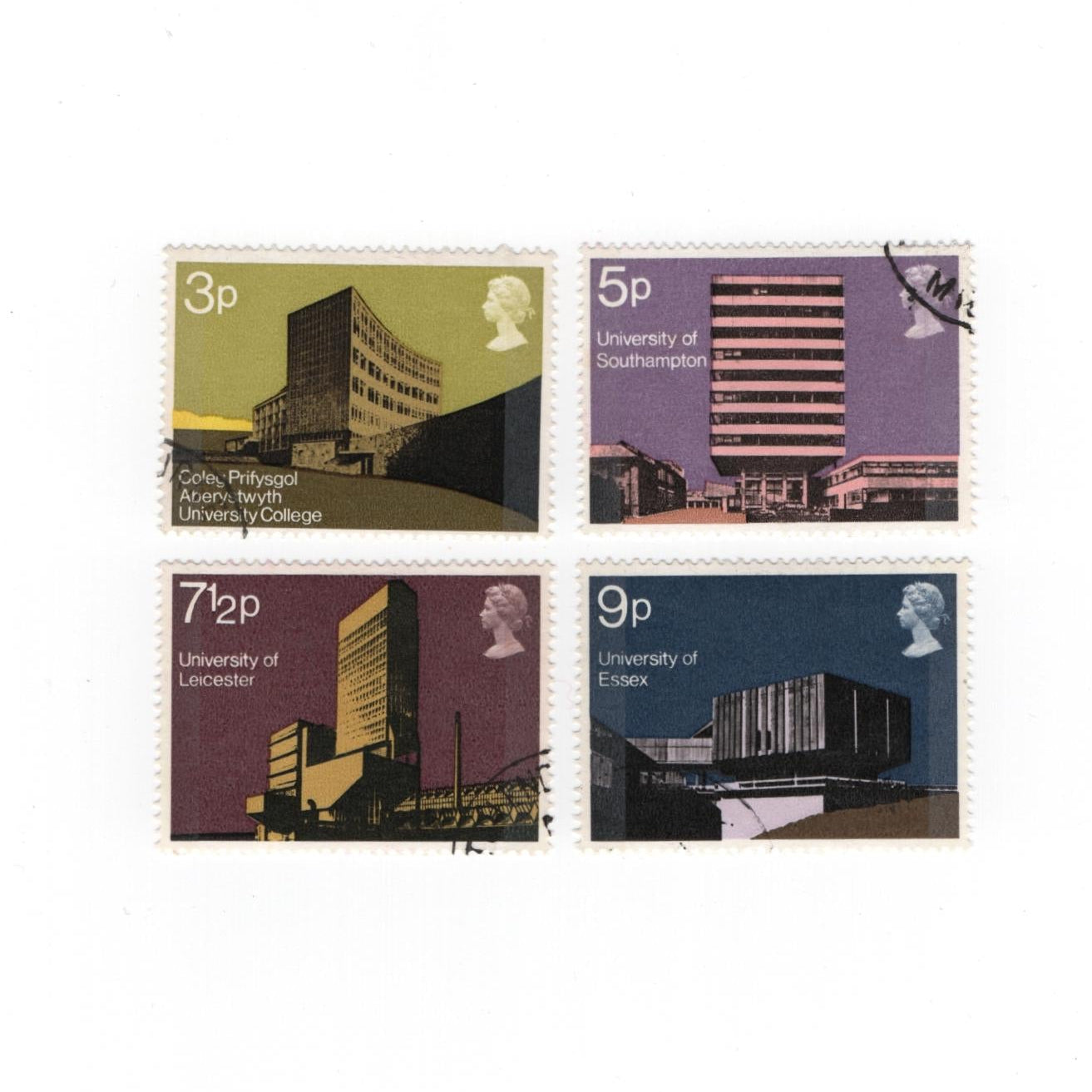 Four postage stamps with architectural designs on a white background