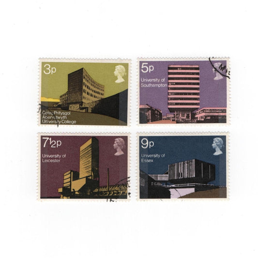 Four postage stamps with architectural designs on a white background