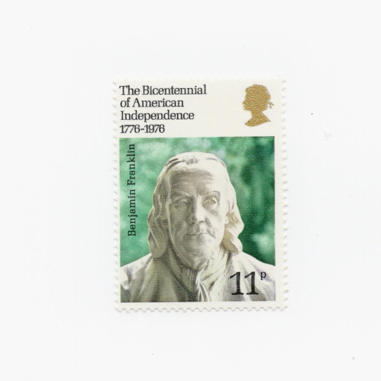 statue of Benjamin franklin on a postage stamp