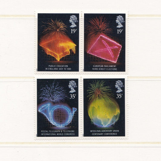 Four postage stamps with colorful designs and text on a white background