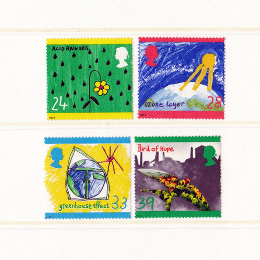 Four colorful stamps with environmental themes on a white background