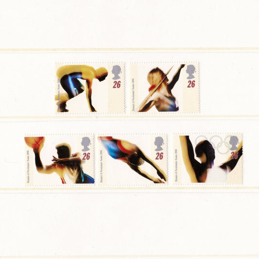 Set of Olympic-themed postage stamps featuring athletes in various sports.